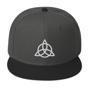 May include: A dark gray and black baseball cap with a white embroidered symbol. The symbol is a stylized triangle with three interlocking circles.