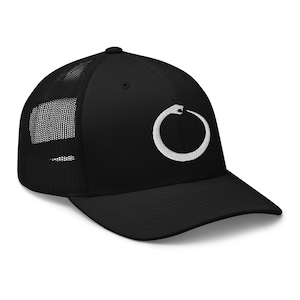 May include: A black and white trucker hat with a white embroidered snake design. The snake is curled in a circle, forming a symbol.