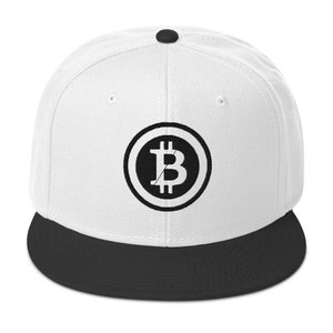 May include: A white and black baseball cap with a black Bitcoin logo on the front. The cap has a black brim.
