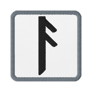 May include: Embroidered patch featuring a black rune symbol on a white background. The patch has a square shape with a gray denim-like border. The rune is a vertical line with two diagonal lines extending from the top.