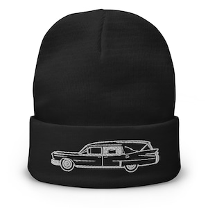 May include: Black beanie with a white embroidered image of a vintage hearse.
