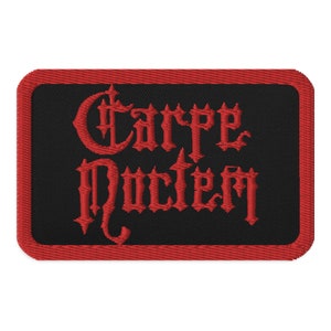 May include: Red embroidered patch with a black background and the text "Carpe Noctem" in a gothic font.