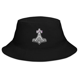 May include: Black bucket hat with a white embroidered Mjolnir, the Norse god Thor's hammer, with a pink outline.