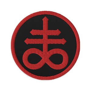 May include: Red embroidered patch with a black background featuring a stylized symbol of a cross with an infinity symbol at the base.