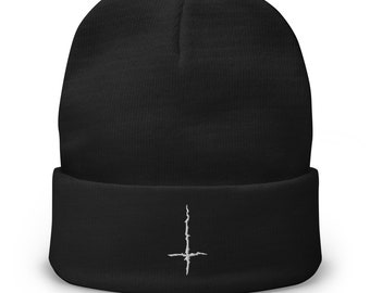 May include: Black beanie with a white upside-down cross embroidered on the front.