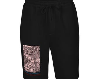 May include: Black sweat shorts with a drawstring waist. A pink and black graphic is printed on the left leg, depicting a historical scene with the text "The Feast of the Impaler" and "Vlad Dracula".