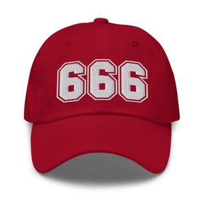 May include: Red baseball cap with white embroidered numbers 666.