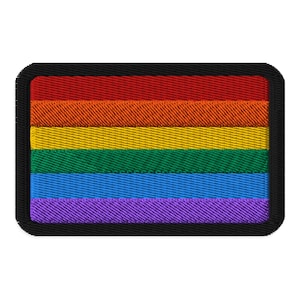 May include: A rainbow pride flag patch with red, orange, yellow, green, blue, and purple stripes. The patch is surrounded by a black border.