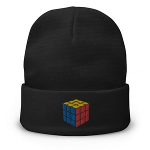 May include: Black beanie with a colorful embroidered Rubik's Cube design.