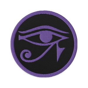 May include: Purple embroidered eye of Horus symbol on a black circular patch.