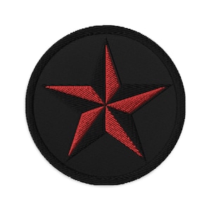 May include: Embroidered patch featuring a red star within a black circle. The star has a five-point design, and the patch has a black border. This patch is suitable for jackets, bags, or other fabric items.