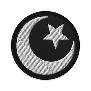 May include: A black and white embroidered patch with a crescent moon and a five-pointed star.