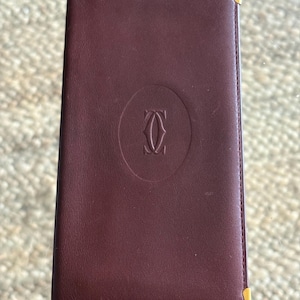 Cartera de cuero vintage Cartier con funda para chequera