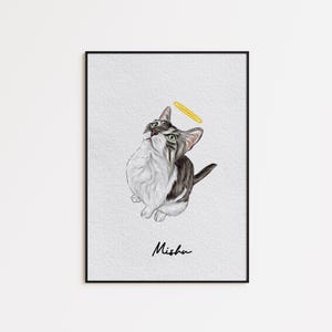 May include: A framed art print featuring a cat with a halo. The cat is depicted in shades of gray and white, with green eyes, looking upwards. A yellow halo hovers above its head. The name "Misha" is written in cursive below the cat.