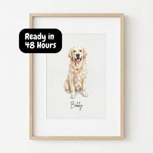 May include: A framed watercolor portrait of a Golden Retriever dog named Bobby. The dog is depicted sitting with its tongue out. The artwork is in a light wooden frame. Text on the image reads "Ready in 48 Hours".