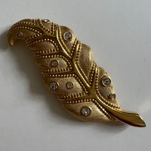 Broche de penas de ouro vintage assinado por Swarovski 100% autenticado