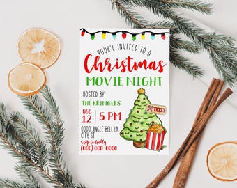 May include: A Christmas Movie Night invitation with festive watercolour illustrations. The invitation features a Christmas tree, popcorn, and string lights. The text reads "You're invited to a Christmas Movie Night".