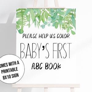 Może przedstawiać: Biały znak na sztaludze z napisem "PLEASE HELP US COLOR BABY'S FIRST ABC BOOK". Na g&oacute;rze znaku znajduje się akwarelowy wz&oacute;r zielonych liści. Mniejszy znak m&oacute;wi "COMES WITH A PRINTABLE 8X10 SIGN".