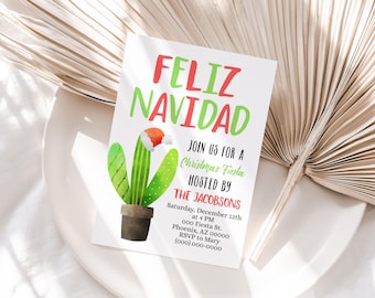 May include: A white invitation card with the words "FELIZ NAVIDAD" in red and green. A cactus wearing a Santa hat is featured below the text. The invitation is for a Christmas Fiesta hosted by The Jacobsons.
