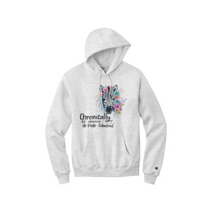 May include: A grey Champion hoodie with a zebra head graphic and the text "Chronically ill-exhausted-in-pain-fabulous" printed on the front.