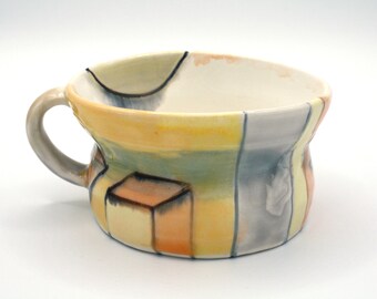 Porcelain mug with orange, yellow and lavender glaze.