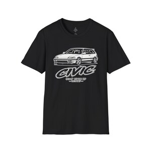 May include: A black short-sleeve t-shirt featuring a white line art graphic of a Honda Civic EF hatchback. Below the car, the text reads CIVIC, followed by Japanese characters, CIVIC EF, and EST. 1987. The design is centered on the chest.