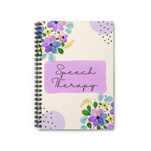 May include: A spiral-bound notebook with a cream-colored cover featuring floral designs in purple, blue, and yellow. The text "Speech Therapy" is written in cursive on a lavender rectangle.