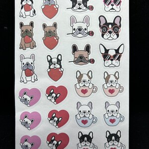 May include: A sheet of stickers featuring various illustrations of French Bulldogs. The stickers depict the dogs in different poses, including holding hearts, wearing sunglasses, and sitting in teacups. The stickers are printed on white paper with a glossy finish.