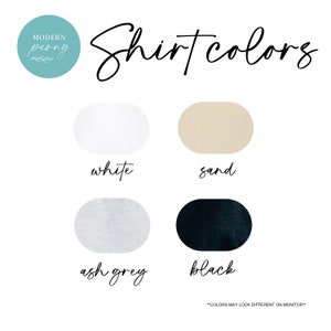 May include: A graphic showing four different shirt colors: white, sand, ash grey, and black. The text "Shirt colors" is written in cursive above the color swatches. The text "Colors may look different on monitor" is written in all caps below the color swatches.