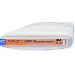 May include: A white roll of Pellon Wonder-Web fusible webbing, 100% polyester, 20 inches wide. The label reads "807 Wonder-Web" and "Made in USA".