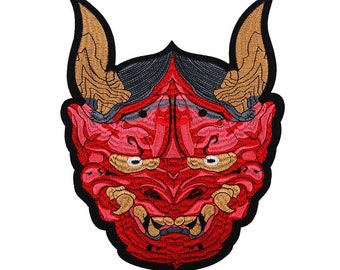 May include: Embroidered patch featuring a red Japanese demon mask with gold horns and teeth, black outline, and gray hair. The patch measures 11 x 8.5 inches.