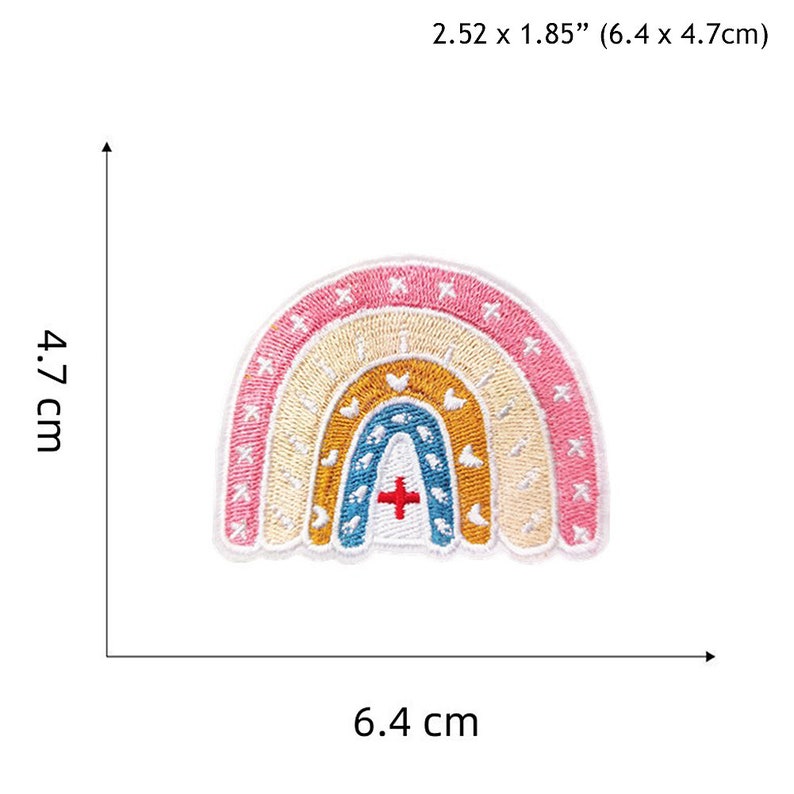May include: An embroidered patch featuring a rainbow with five colours: pink, orange, yellow, blue, and green. The rainbow has a red cross in the centre. The patch measures 6.4 cm wide and 4.7 cm tall.
