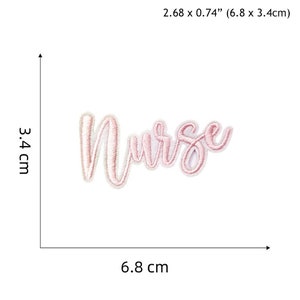 May include: Pink embroidered iron-on patch with the word "Nurse" in a cursive font. The patch is 6.8 cm by 3.4 cm.