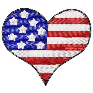 May include: A red, white, and blue heart-shaped sequin patch with a design of the American flag. The patch has 13 red and white stripes and a blue field with 50 white stars.