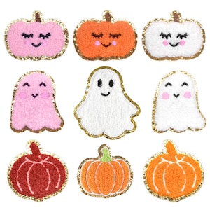 May include: Nine felt Halloween-themed iron-on patches.  There are three pink ghosts, three orange pumpkins, and three red pumpkins.  Each patch has a gold glitter outline.