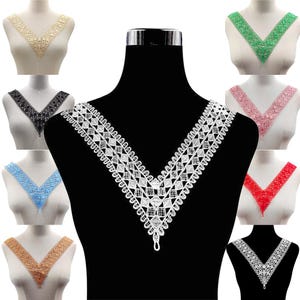 May include: A selection of V-neck lace collars in diverse colours, such as white, black, beige, blue, green, pink, red, and gold. Each collar is displayed on a mannequin, highlighting the detailed lace patterns and designs.