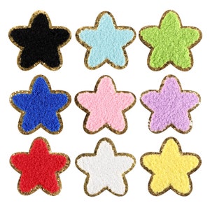 May include: Nine star-shaped fabric patches with gold glitter trim. The stars are in various colors: black, light blue, green, blue, pink, purple, red, white, and yellow.