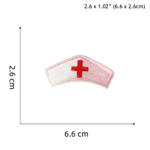 May include: White and pink embroidered nurse's cap patch with a red cross. The patch is 2.6 inches by 1.02 inches (6.6 cm by 2.6 cm).