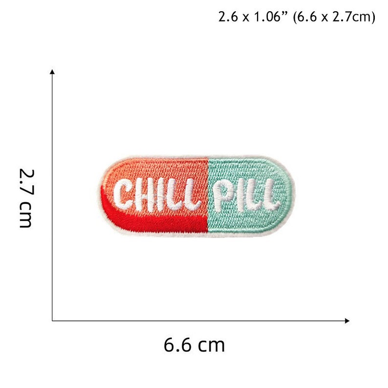 May include: An embroidered iron-on patch shaped like a pill with the words "CHILL PILL" in white thread on a red and blue background. The patch measures 6.6 cm by 2.7 cm.