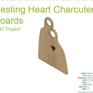 May include: Two wooden heart-shaped cutting boards, nested together, with a small red heart cutout in the center. The boards are designed for charcuterie and are a CNC project.