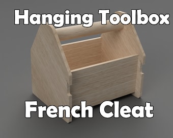 May include: A wooden hanging toolbox with a handle, designed to be mounted using a French Cleat system. The toolbox is made of light brown wood and has a rectangular shape.