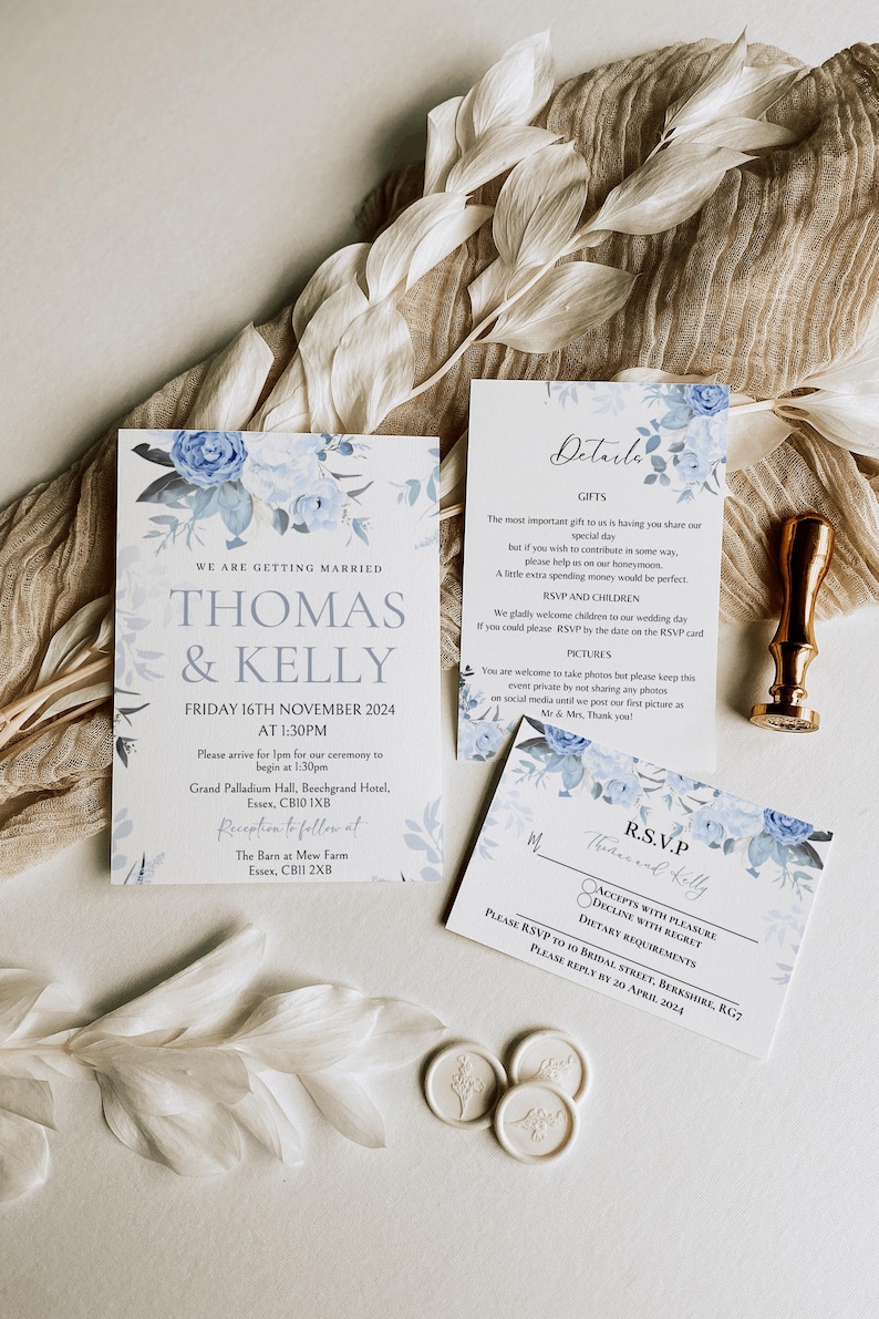 May include: A wedding invitation with blue floral designs. The invitation reads "We are getting married, Thomas & Kelly, Friday 16th November 2024 at 1:30pm". The invitation includes the ceremony and reception locations.