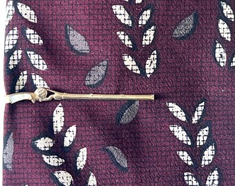 Pinza para corbata con forma de caña de pescar Swank vintage - Tono dorado con mango de nácar - Circa 1970