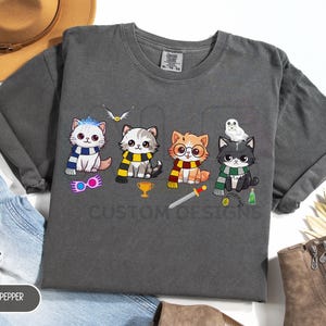 Comfort Colors® Cute Wizarding School House Cats T-Shirt, Universal Vacation T-Shirt, Wizard World Gift, Vintage Wizard Houses Shirt
