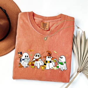 Comfort Colors® Halloween Wizard Houses Ghosts Shirt, Universal Vacation Shirt, Vintage HP Houses Shirt, Family Vacation Matching Shirt