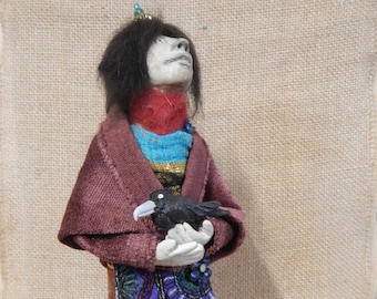 Handmade art doll with crow totem