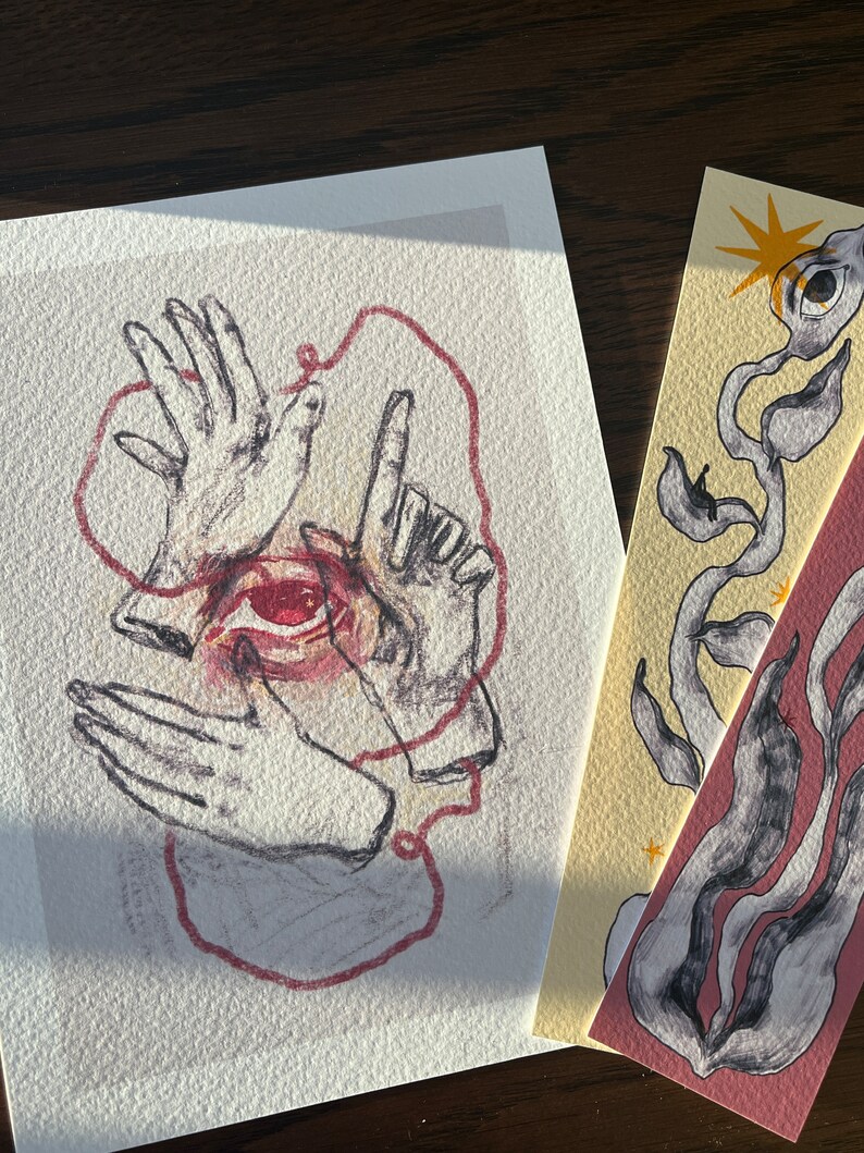May include: A hand-drawn illustration of an eye surrounded by three hands, connected by a red string. The drawing is in black and white with red accents.