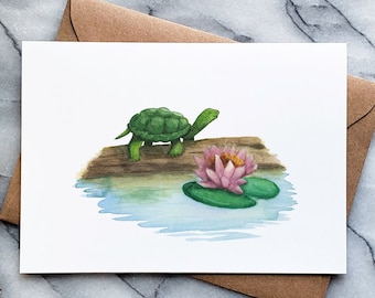 May include: A watercolor illustration of a green turtle walking on a log towards a pink water lily in a pond.