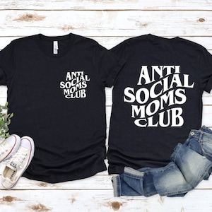 May include: Two black t-shirts with the text "Anti Social Moms Club" in white. One shirt has the text on the front, the other on the back.