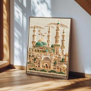 May include: A framed, detailed relief artwork depicting a Middle Eastern mosque with multiple minarets and a central green dome. The artwork features intricate architectural details in beige and gold tones, with a textured background.